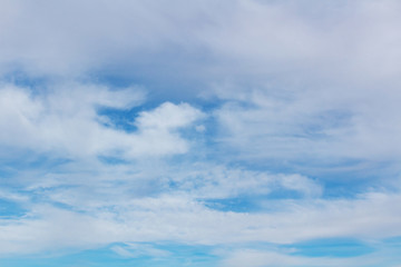 Background with white clouds on blue sky. Abstract background