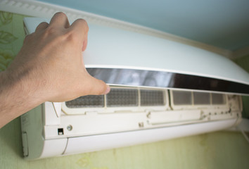 opening the lid of the air conditioner