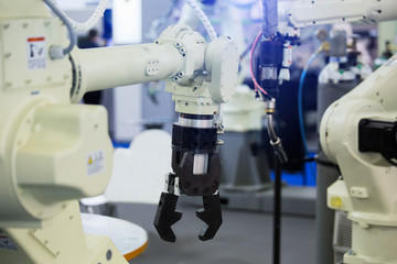 A robotic arm. Automatic robot in a smart factory. Assembly line
