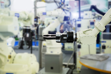 Fototapeta na wymiar A robotic arm. Automatic robot in a smart factory. Assembly line