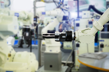 A robotic arm. Automatic robot in a smart factory. Assembly line