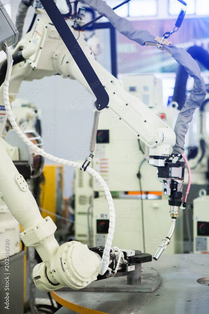 Aufkleber Automatic welding robot in a modern factory in operation. 