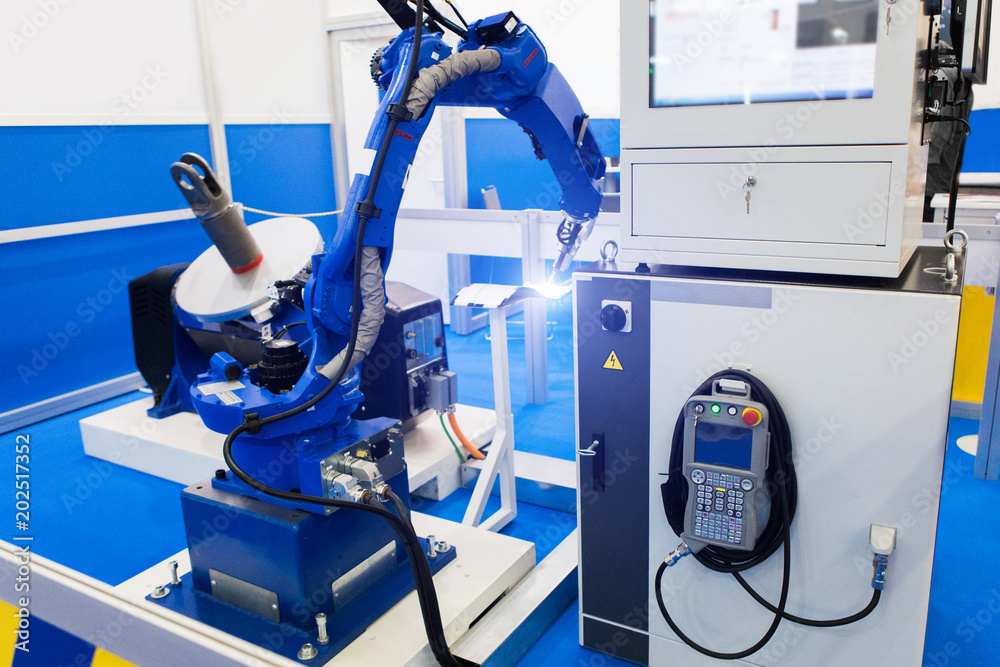 Poster Automatic welding robot in a modern factory in operation. 