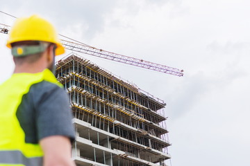 Building construction worker engineer posing