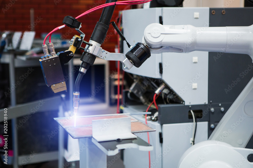 Poster Automatic welding robot in a modern factory in operation. 