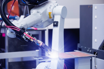 Automatic welding robot in a modern factory in operation. 
