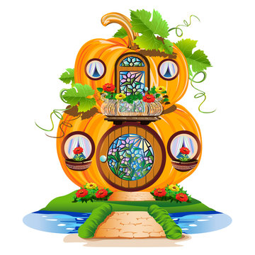 small pumpkin house with a round door and stained glass windows