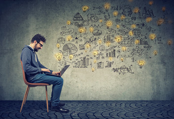 man entrepreneur working on laptop computer has plenty of successful ideas.