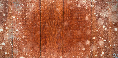 Snow against wooden plank 