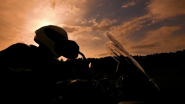 Motorcyclist Starting his Sports Motorbike at Sunset Slow Motion.
Steady cam shot of a young man starting his motorbike in spring.
Low angle wheel view of a cross motorcycle in action.