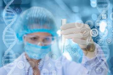 Doctor looks at the test tube with the test.