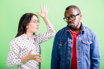 Friends are fighting, standing on green background