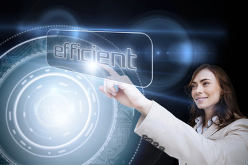 Businesswoman pointing to word efficient against black background with glowing circle