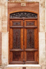 Fototapeta na wymiar Old facade and entrance of majestic house in Alcaraz, Albacete province, Spain