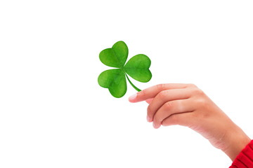 Shamrock against hand raised up