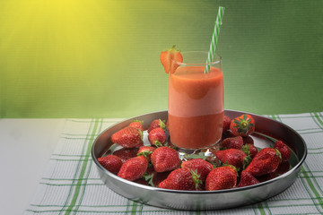 Strawberry juice with fresh ripe red berries
