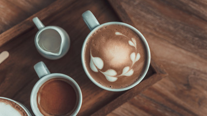 Hot Latte Coffee On Wooden Saucer