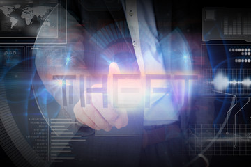 Fototapeta premium Businessman presenting the word theft against glowing blue pattern on black background