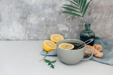 Top view Tea with lemon and ginger on rustic table