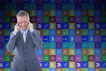 Businessman with headache against app wall