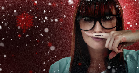 Happy smiling hipster with a mustache against snow