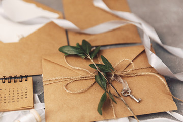 Kraft envelope with olive branch. Wedding concept