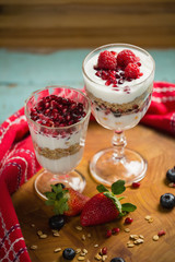 Cup of cereals with fruits and yogurt