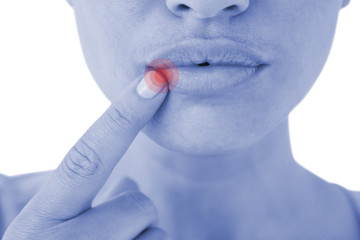 Woman pointing her lips against highlighted pain