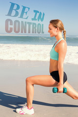 Fit woman doing weighted lunges on the beach against be in control