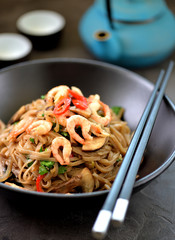 Buckwheat noodles soba with shrimp, vegetables and mushrooms.