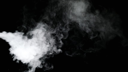 White water vapour on a black background. Close-up shot