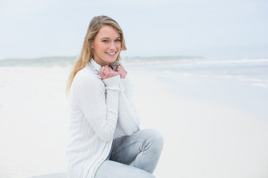 Smiling casual young woman relaxing at beach