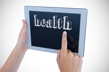 The word health against woman using tablet pc 