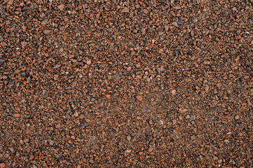 Texture background wallpaper of a large amount of pebbles stone in brown tones