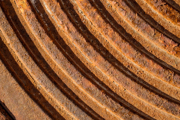 Close up macrophotography texture of round lines on the brown concrete ground