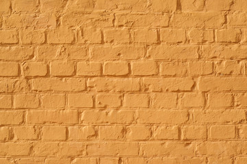 painted building brick wall in orange color