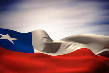 Naklejka premium Chile flag waving against blue cloudy sky