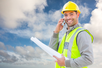 Happy architect against blue sky with white clouds