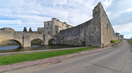 Fototapeta na wymiar Aigues Mortes city - Bridge, Walls and Tower of Constance - Camargue - France