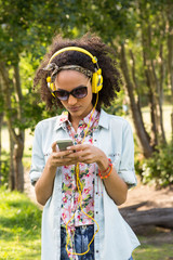 Pretty hipster using her smartphone 