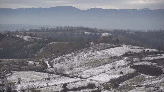 Snowy hills seen during winter