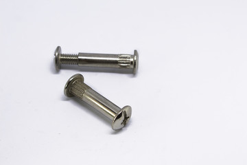 Screws for furniture, silver color.  On a white background