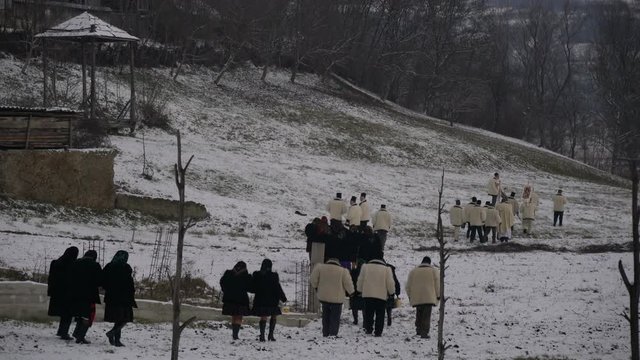 Locals walking on a field, Oncesti 