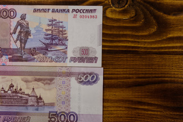 500 russian rubles banknotes on wooden background. Top view