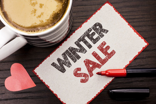 Text sign showing Winter Sale. Conceptual photo Promotion Offer Shop Discount Season Offers Auction Deal Objective written on Sticky Note on the wooden background Coffee Cup Heart Marker next to it.