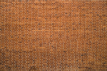 Old realistic brick wall made of red brick in different shads. Red smooth brickwork.