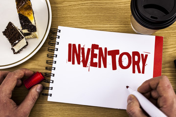 Conceptual hand writing showing Inventory. Business photo showcasing Complete list of items like products goods in stock properties written by Man on Notebook on wooden background Cake and Cup.