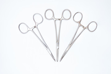 three surgical clamps