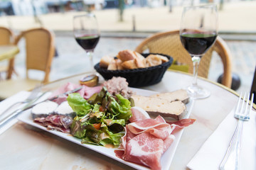 Meat and Cheese Platter with red wine at a French Cafe in Paris