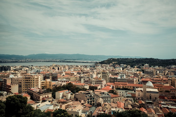 Fototapeta premium Italy Cagliari city, historical center houses and parks, europe vacations, summer landmarks buildings and trees